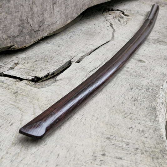 High-quality wooden bokken for martial arts training, crafted from durable wood with a smooth finish. Ideal for kendo, aikido, and samurai sword practice.
