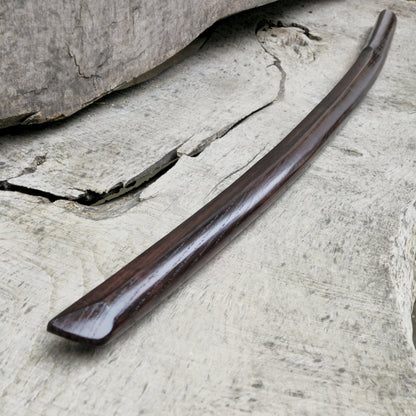 High-quality wooden bokken for martial arts training, crafted from durable wood with a smooth finish. Ideal for kendo, aikido, and samurai sword practice.