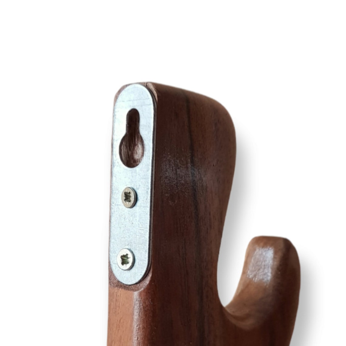 A wall mounted wooden rack designed to hold a sword, ax, or rifle, featuring a natural walnut finish.